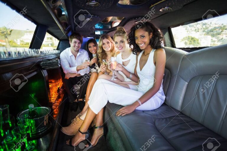 54391651-happy-friends-drinking-champagne-in-limousine
